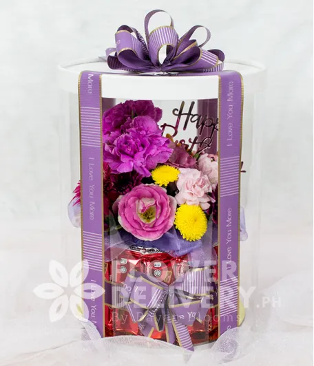 Elegant Flowers with Kitkat in a Round Box